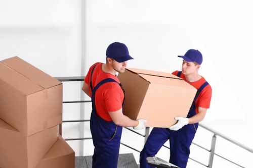 Commercial moving team handling office furniture in Shepherds Bush