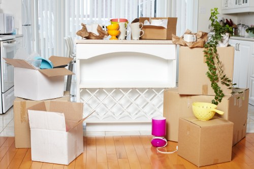 Two movers handling furniture carefully in a narrow space