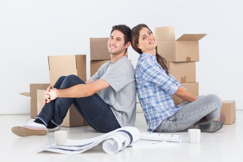 Packed office equipment ready for commercial moves in Shepherds Bush