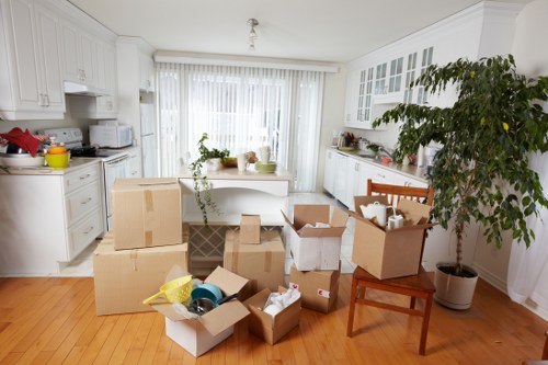 Careful loading of household furniture by movers in Shepherds Bush
