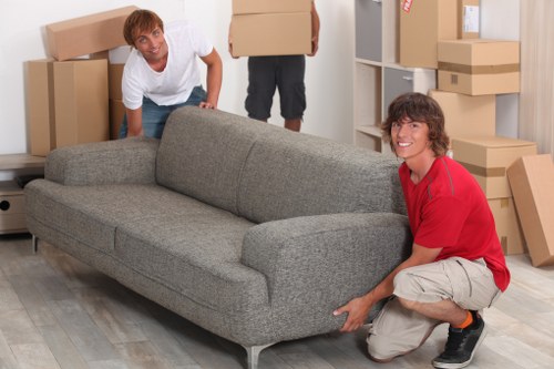 Careful handling of furniture during a house move in West London
