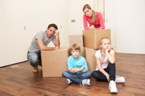 Packed boxes and furniture protection ready for a Shepherds Bush move
